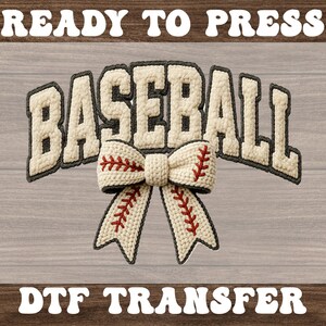 May include: A baseball-themed DTF transfer design. The word "BASEBALL" is in a cream-colored, textured font with a gray outline. A cream-colored bow with red stitching, resembling a baseball, is centered below the word. The words "READY TO PRESS" and "DTF TRANSFER" are in white, arched above and below.