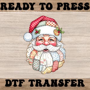 May include: A colorful Santa Claus design with a patchwork beard and hat, adorned with berries and polka dots. The image includes the text "READY TO PRESS" and "DTF TRANSFER".