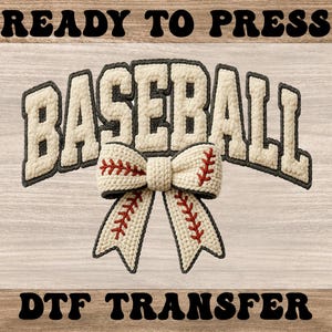 May include: A baseball-themed DTF transfer design. The word "BASEBALL" is displayed in a textured, off-white font with a dark gray outline. A bow with baseball stitching is centered below the word. The words "READY TO PRESS" and "DTF TRANSFER" are above and below.