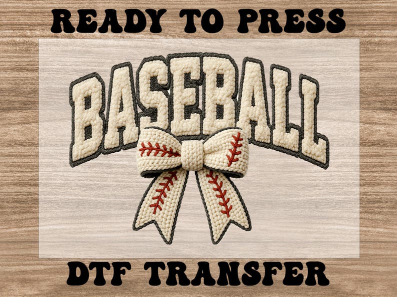 May include: A baseball-themed DTF transfer design. The word "BASEBALL" is displayed in a textured, off-white font with a dark gray outline. A bow with baseball stitching is centered below the word. The words "READY TO PRESS" and "DTF TRANSFER" are above and below.