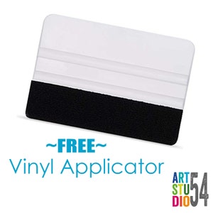 May include: A clear, rectangular vinyl applicator with a black felt edge. The text "~FREE~ Vinyl Applicator" is in blue. The Art Studio 54 logo is in the bottom right corner.