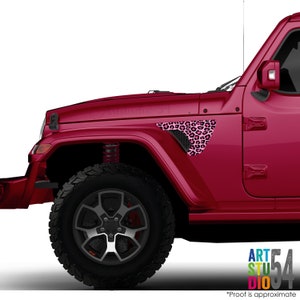 May include: A maroon Jeep with a black tire and a pink leopard print decal on the front fender. The decal is a triangular shape with a black mesh vent. The text "ART STUDIO 54" is visible in the bottom right corner.
