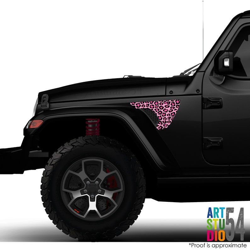 May include: Black Jeep with a pink leopard print design on the front fender. The design is a triangular shape with a honeycomb mesh pattern. The text "ART STUDIO 54" is visible in the bottom right corner.