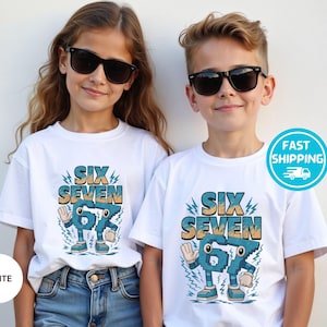 May include: Two children wearing white t-shirts with the text "SIX SEVEN" in a retro font. The graphic features animated numbers with arms and legs. Both children are wearing black sunglasses and blue jeans.