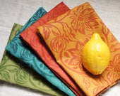 Fiesta linen napkins in marigold, zinnia, sea green, and olive hand block printed set of four