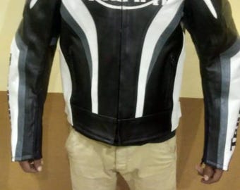 May include: Black leather motorcycle jacket with white and gray stripes and the word "TRIUMPH" in white on the chest.