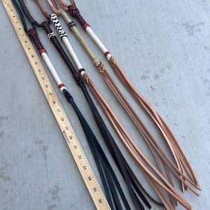 May include: A set of three ceramic mugs with a speckled, matte finish. The mugs are in shades of cream, light gray, and dark gray. Each mug has a simple, minimalist design and a rounded handle. The mugs are suitable for coffee or tea.