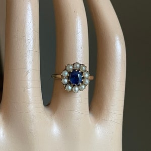 A Late Victorian Edwardian Cushion Cut Synthetic Sapphire and Pearl Ring