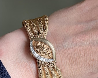 An Exceptional Mid Century Mesh 14K Yellow Gold Longines Surprise Watch