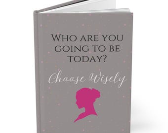 May include: Gray journal with a pink silhouette of a woman and the text "Who are you going to be today? Choose Wisely".