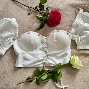 White corset top with floral embroidery