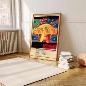 May include: A vintage poster for the Super Nintendo game EarthBound. The poster features a colorful illustration of a flying saucer with a large, yellow eye in the center. The text "EarthBound" is written in a bold, white font. The poster also includes the text "Super Nintendo" and the release date "August 27, 1994".