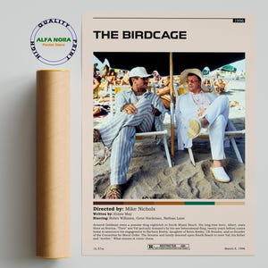 May include: A rolled-up poster of "The Birdcage" movie. The poster features a beach scene with two men in white and striped suits, sitting in beach chairs. The poster includes the movie title, credits, and a "Quality Print" seal.
