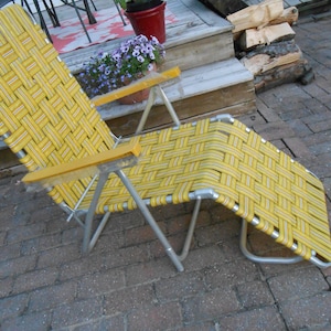 Vintage aluminum folding lawn chair lounger chaise lounge webbed Yellow with tiny blackand orange stripes, Still in plastic, NOS Excellent
