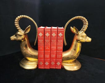 Par de sujetalibros vintage de latón macizo brillante con forma de cabra montesa, estilo MCM.