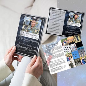 May include: Three printed cards for a retirement ceremony. The cards feature a photo of a man in uniform, the text "20 Years of Service," and the name "Michael B. Brown." The cards have a silver border and a dark blue background.