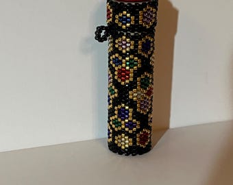 Hand beaded needle case wooden tube.