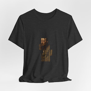 Könnte beinhalten: Dunkelgraues T-Shirt mit einem Porträt eines Mannes mit langem Bart, unterteilt durch vertikale Linien. Das Porträt ist in Braun- und Beigetönen gehalten. Das T-Shirt besteht aus einem weichen Material.