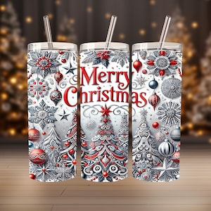 May include: Three stainless steel tumblers with a festive Christmas design. Each tumbler features a white background with red and silver ornaments, snowflakes, and Christmas trees. The centre tumbler reads "Merry Christmas" in red script.