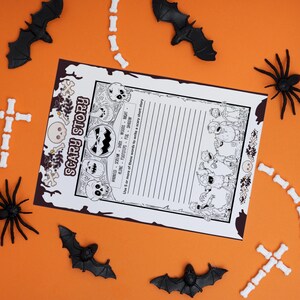 May include: A printable Halloween activity sheet with a spooky theme. The sheet features a pumpkin, skulls, and a list of words to use for writing a scary short story. The words include: haunted, scream, dark, woods, night, lone, footsteps, fog, shadow.