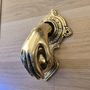 Hand Fist Ball Knocker Rustic Polished Brass Pull