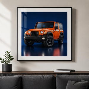 Puede incluir: Una impresión artística enmarcada que muestra un SUV Mahindra Thar de color naranja brillante con parrilla, parachoques y ruedas en negro. El vehículo está posicionado sobre un fondo azul oscuro sólido, creando un contraste con la pintura naranja.