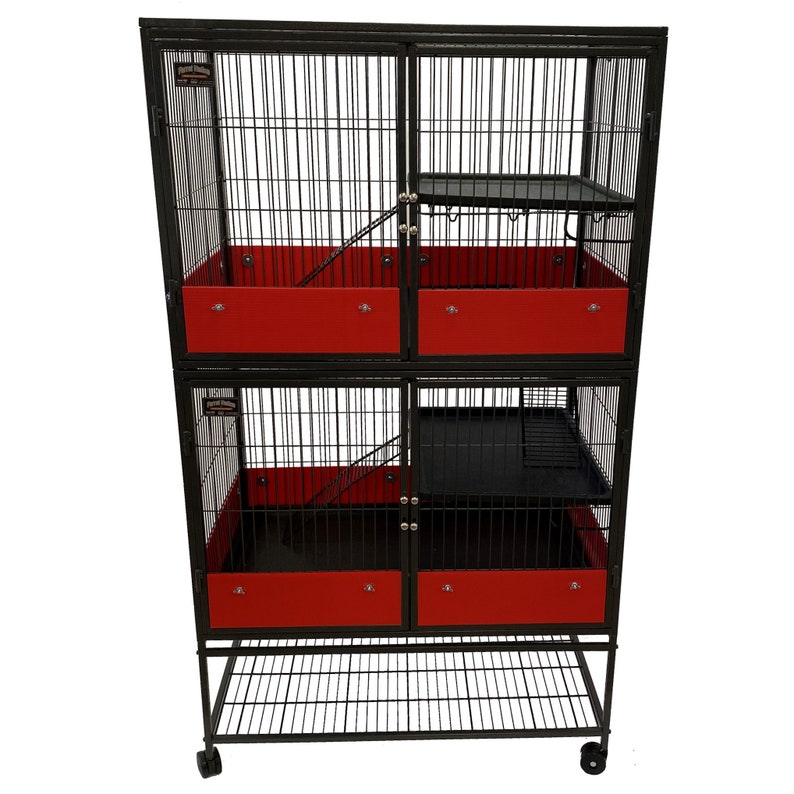 May include: Black metal cage with red plastic trays and a black metal shelf. The cage has two levels and is on wheels.