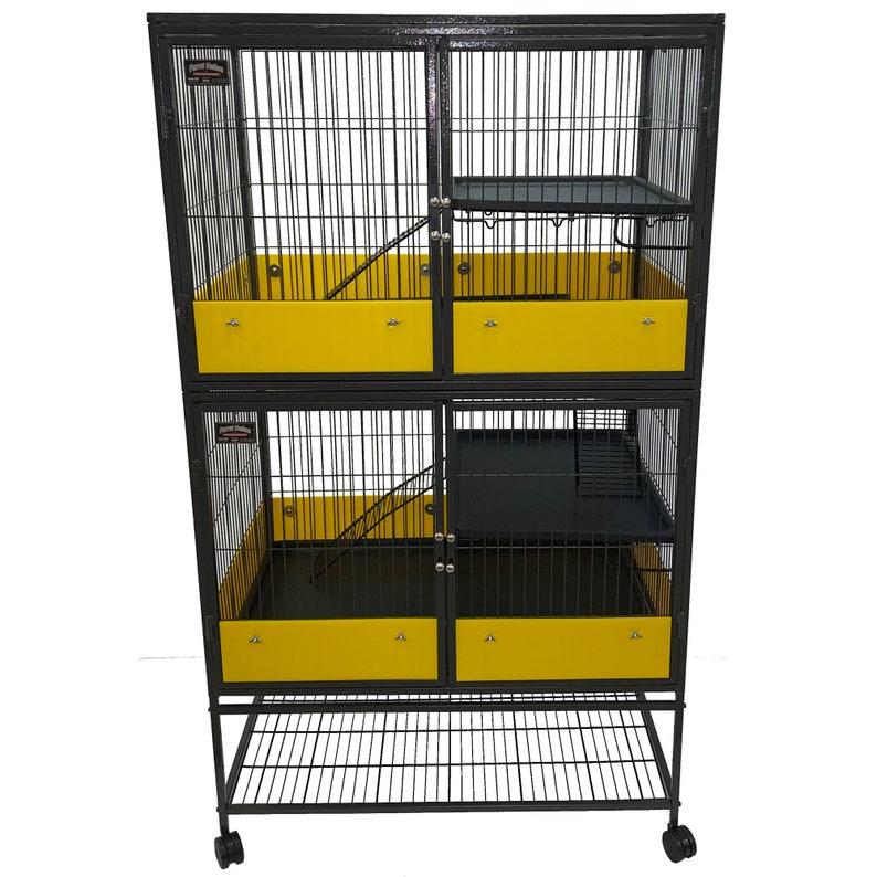 May include: A black metal multi-level cage with yellow plastic trays and a black wire shelf. The cage has two doors and two ramps. The cage is on wheels.