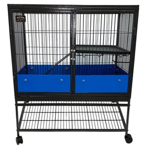 May include: Black metal cage with a blue plastic bottom and a shelf. The cage has a ramp and a door. The cage is on wheels.