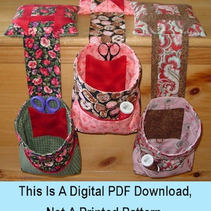 May include: Four fabric hanging pockets with red, pink, brown, and green floral patterns. Each pocket has a different fabric lining and contains sewing supplies, such as scissors and spools of thread. The text "This Is A Digital PDF Download, Not A Printed Pattern." is at the bottom of the image.