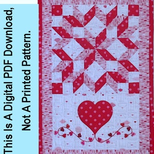 May include: A red and white quilt block with a heart design. The heart is surrounded by a vine of small red hearts. The quilt block is made of fabric with a white background and a pink polka dot pattern.