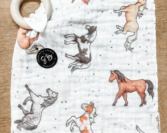 organic muslin gauze teether and swaddle - spotted horses