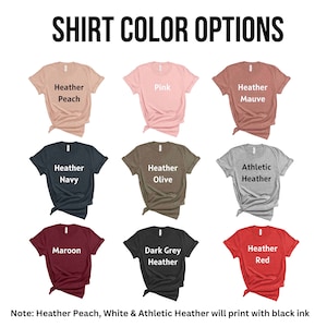 May include: A chart showing 10 different t-shirt colors. The colors are: Heather Peach, Pink, Heather Mauve, Heather Navy, Heather Olive, Athletic Heather, Maroon, Dark Grey Heather, Heather Red. Note: Heather Peach, White & Athletic Heather will print with black ink.