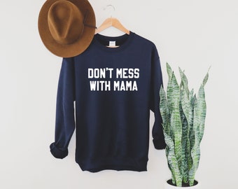 May include: Navy blue sweatshirt with white text that reads "Don't mess with mama".