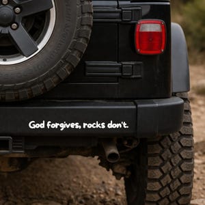 God Forgives Rocks Don’t Sticker – Off Road Bumper Sticker – Jeep Truck Decal – White on Clear Vinyl – 8 in. or 10 in. Tacoma Jeep Sticker