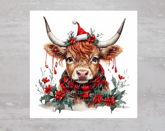 May include: A brown and white cow wearing a red Santa hat and a red and black plaid scarf. The cow is surrounded by green holly and red berries.