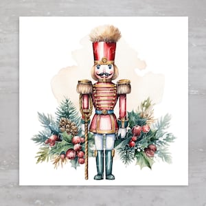 May include: Watercolor painting of a red and gold toy soldier with a blue and white uniform, holding a stick. The soldier is surrounded by green holly and red berries.