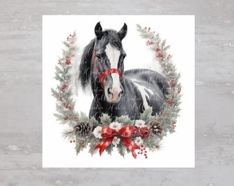 May include: A black and white horse with a red ribbon around its neck is surrounded by a green wreath with red berries and pine cones.