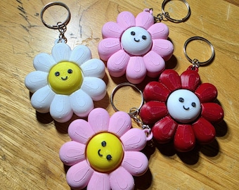 Lächelnde Blume Schlüsselanhänger - lustiges Fidget-Spielzeug-Accessoire
