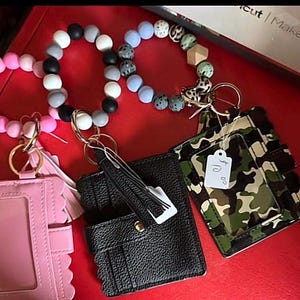 Wristlet wallets with beads