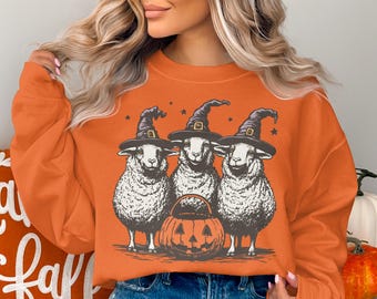 ハロウィンの羊のスウェットシャツ、魔女の羊の不気味な季節のセーター、かわいいカボチャの農場動物のクルーネック、秋のコテージコアの居心地の良い秋のグラフィックシャツ