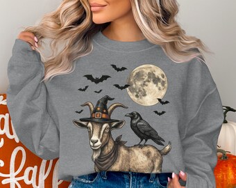 魔女のヤギ柄スウェットシャツ、ヴィンテージハロウィンクロウ柄クルーネック、レトロな不気味な農場動物柄トップス、ゴシック満月魔女帽子ジャンパー、彼女への秋のギフト