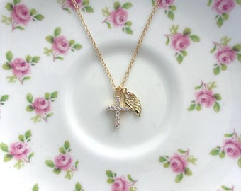 Gold crystal and angel charm necklace.