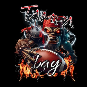 May include: A digital illustration of a fierce, red-eyed, monster wearing a red bandana and holding a football. The monster is surrounded by flames and lightning bolts. The text "Tampa Bay" is written in red and white letters above the monster.