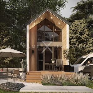 May include: A modern tiny house with a large glass window and wooden accents. The house has a small porch with a table and chairs, and is surrounded by trees and landscaping. The text "SAFE CAMP DESIGN STUDIO" is visible.