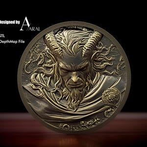 May include: A gold-colored metal coin with a detailed relief sculpture of a horned, bearded man's face. The coin has a raised rim and a smooth surface.