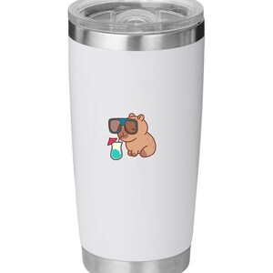May include: White stainless steel tumbler with a cartoon illustration of a brown bear wearing sunglasses and holding a cocktail. The tumbler has a silver rim and lid, perfect for cold beverages.
