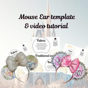 May include: A pair of pink and white mouse ears with a bow and a white lace trim. The ears are decorated with a pink and white floral pattern and a cartoon cat. The ears are on a headband. The image also includes two pieces of paper with the text "Fabric" and instructions for making the ears.