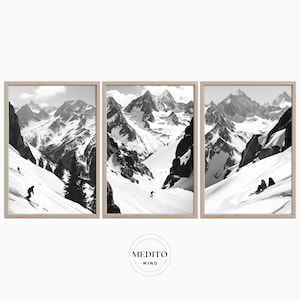May include: A black and white photograph of a snowy mountain range with skiers on a slope. The photo is split into three sections, each showing a different view of the mountain.