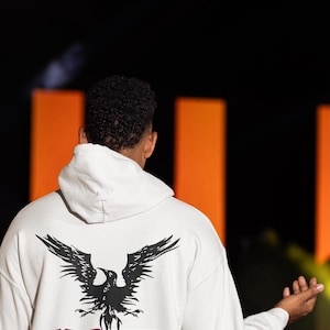 May include: A white hoodie with a black bird graphic and the text "ALTER BRIDGE blackbird" on the back.